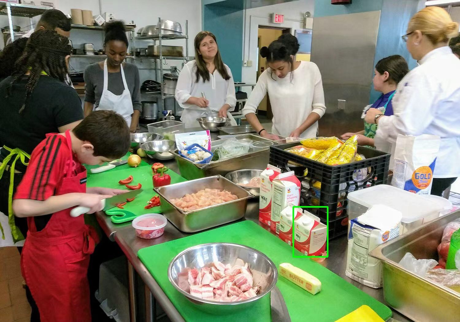 Photo of two dogs running side-by-side in shallow water