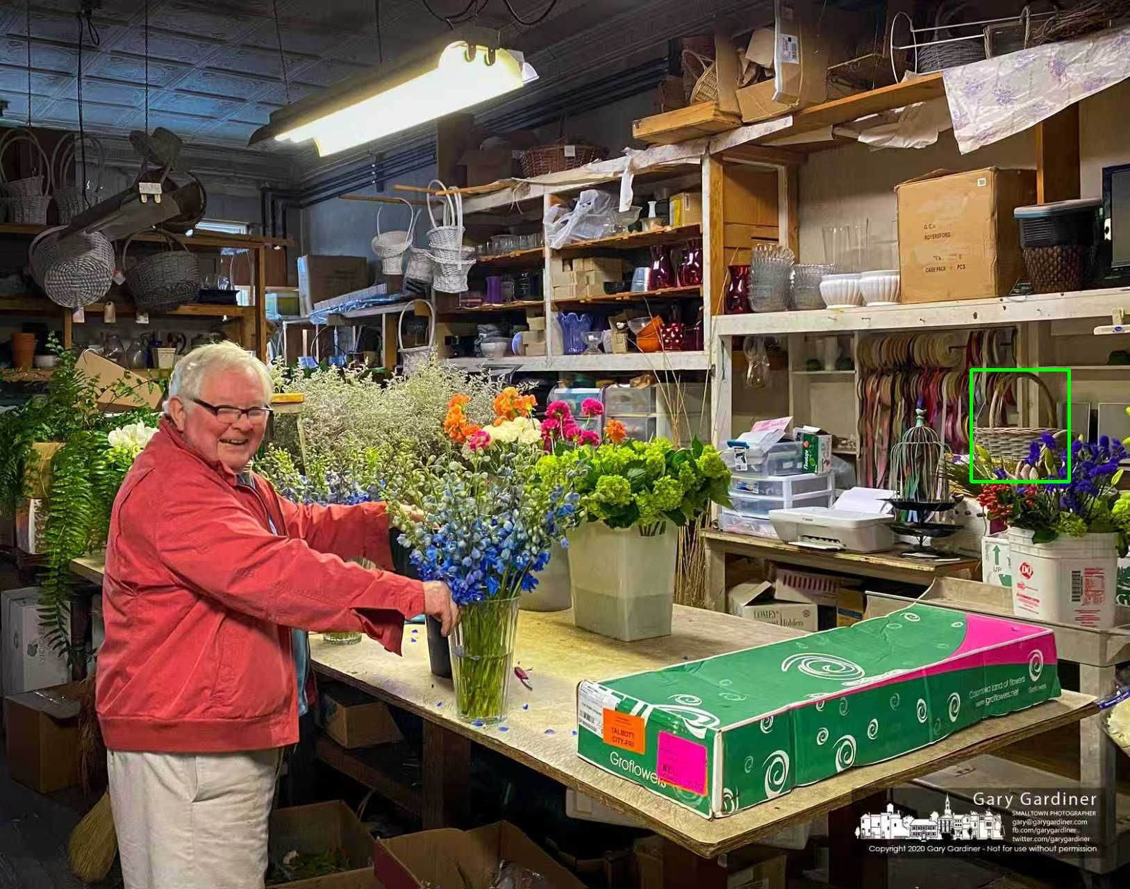 Photo of two dogs running side-by-side in shallow water